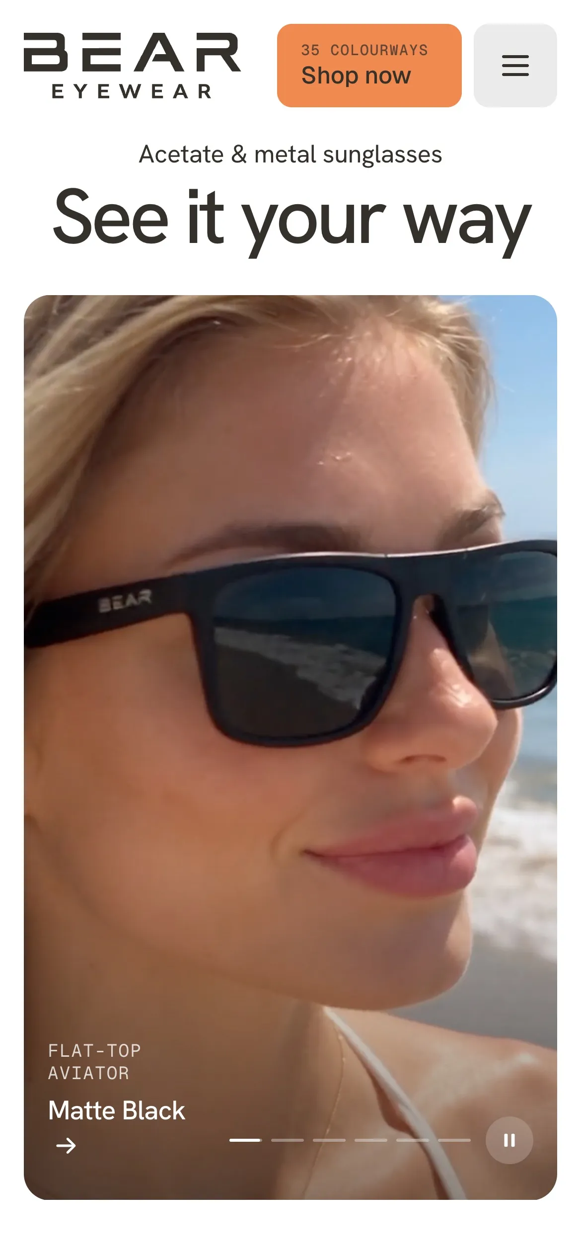 Bear Eyewear homepage on a phone, showing the "See it your way" headline and a featured Flat-Top Aviator in Matte Black.
